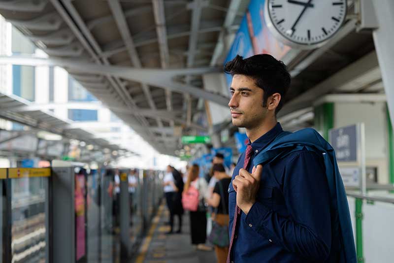 BTS Skytrain arriving at stations about once every three to five minutes during peak hours.